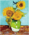 Drei Sonnenblumen in einer Vase